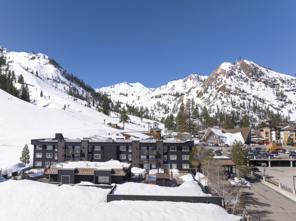 view of snow covered mountains and buildings